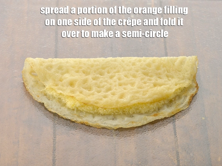 Step 18 – <p><span style="background-color:rgb(255,255,255);color:rgb(0,0,0);">Place a <strong>crêpe</strong> on a clean, dry surface, spread a portion of the <strong>orange …