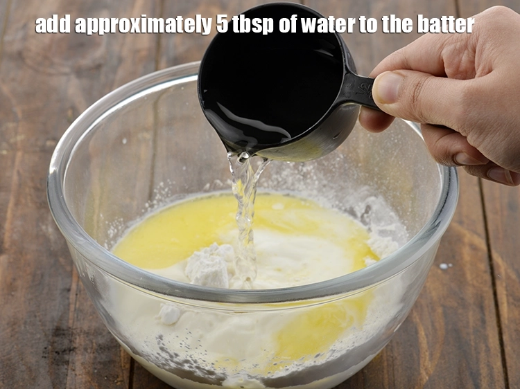 Step 6 – <p><span style="background-color:rgb(255,255,255);color:rgb(0,0,0);">Finally add approximately 5 tbsp. of <strong>water</strong> to the batter.</span></p>