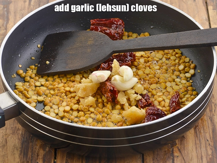 Step 9 – <p>Also, add the <span style="background-color:rgb(255,255,255);color:rgb(0,0,0);">3 </span><a href="https://www.tarladalal.com/glossary-garlic-lehsun-lahsun-348i#ing_2537"><u>garlic (lehsun) cloves</u></a>. If you are Jain or do …