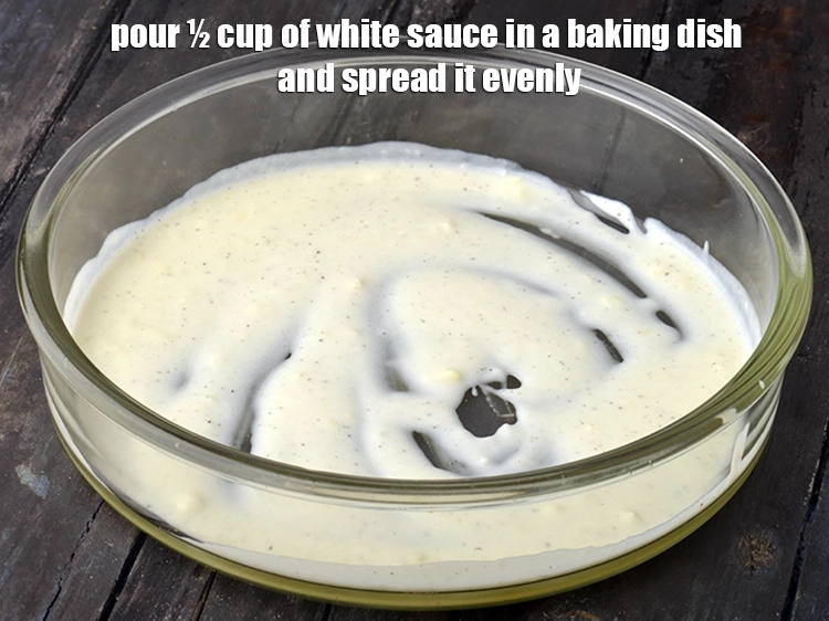 Step 19 – <p><span style="background-color:rgb(255,255,255);color:rgb(0,0,0);">Pour ½ cup of </span><a href="https://www.tarladalal.com/white-sauce---for-baking-113r"><u>white sauce</u></a><span style="background-color:rgb(255,255,255);color:rgb(0,0,0);"> in a baking dish and spread …