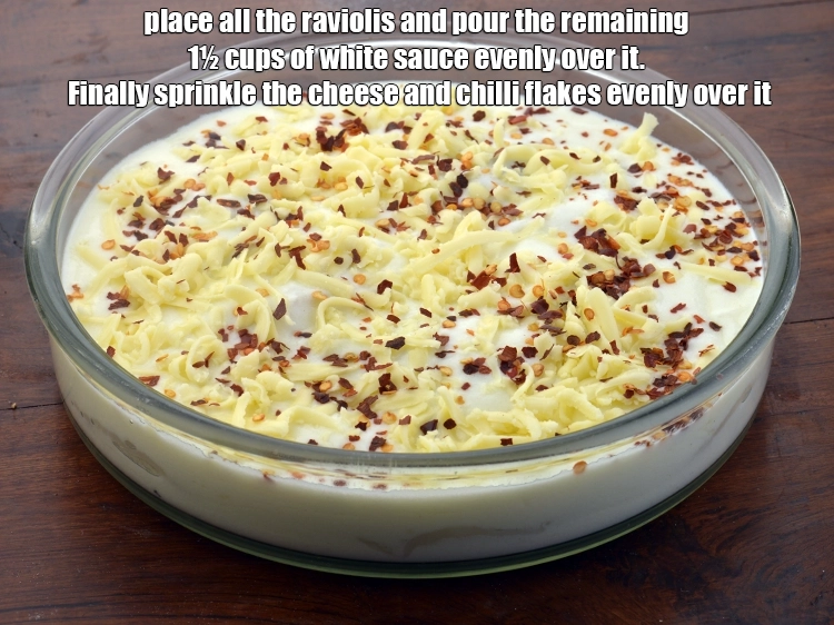 Step 20 – <p><span style="background-color:rgb(255,255,255);color:rgb(0,0,0);">Place all the <strong>raviolis</strong> and pour the remaining 1½ cups of </span><a href="https://www.tarladalal.com/white-sauce---for-baking-113r"><strong><u>white sauce</u></strong></a><span …