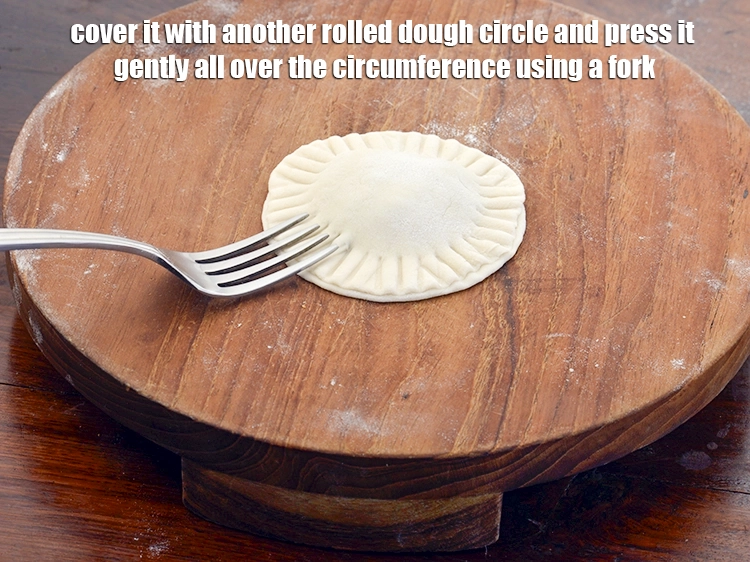 Step 11 – <p><span style="background-color:rgb(255,255,255);color:rgb(0,0,0);">Cover it with another rolled dough circle and press it gently all over the …