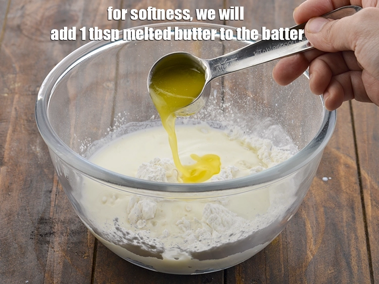Step 5 – <p>For softness, we will add <span style="background-color:rgb(255,255,255);color:rgb(0,0,0);">1 tbsp. </span><a href="https://www.tarladalal.com/glossary-butter-makhan-233i#ing_3123"><u>melted butter</u></a> to the batter.</p>