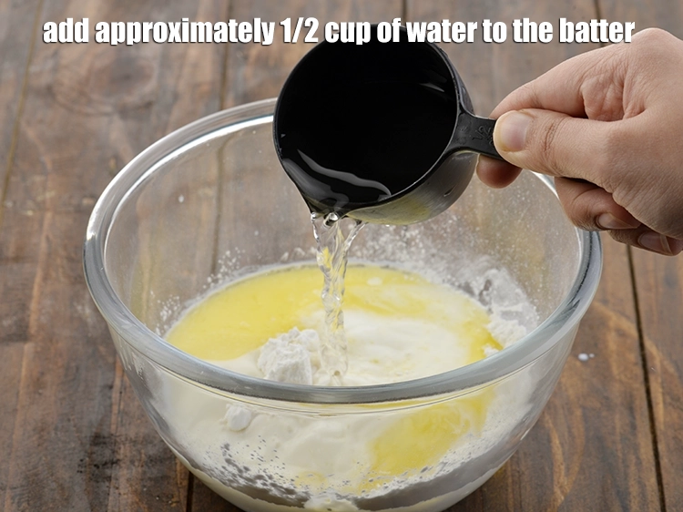 Step 6 – <p>Finally add approximately 1/2 cup of <strong>water</strong> to the batter.</p>
