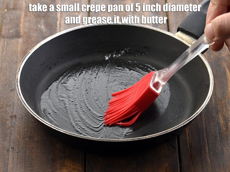 Step 9 – <p>Take a <strong>small crepe pan</strong> of 5 inch diameter and grease it with <a href="https://www.tarladalal.com/glossary-butter-makhan-233i#ing_3123"><u>butter</u></a>..</p>