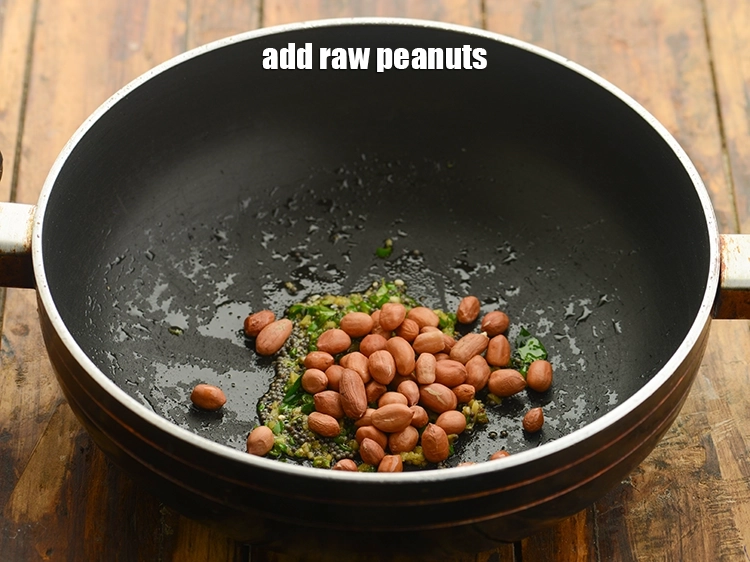 Step 17 – <p>Add the <span style="background-color:rgb(255,255,255);color:rgb(0,0,0);">2 tbsp </span><a href="https://www.tarladalal.com/glossary-raw-peanuts-kachi-mungfali-kachi-moongfali-847i"><u>raw peanuts</u></a>.</p>