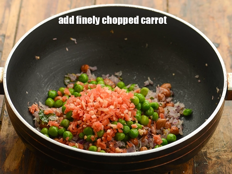 Step 22 – <p>Follow it by adding <span style="background-color:rgb(255,255,255);color:rgb(0,0,0);">1/4 cup finely </span><a href="https://www.tarladalal.com/glossary-carrot-gajar-gajjar-253i#ing_2376"><u>chopped carrot</u></a>.</p>