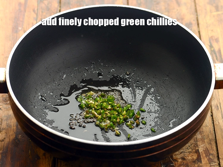 Step 13 – <p>Add the <span style="background-color:rgb(255,255,255);color:rgb(0,0,0);">1 tsp finely </span><a href="https://www.tarladalal.com/glossary-green-chillies-hari-mirch-331i#ing_2388"><u>chopped green chillies</u></a>.</p>