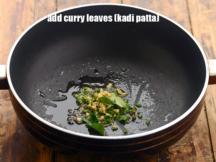 Step 15 – <p>Add a few <span style="background-color:rgb(255,255,255);color:rgb(0,0,0);">4 </span><a href="https://www.tarladalal.com/glossary-curry-leaves-kadi-patta-kadipatta-388i"><u>curry leaves (kadi patta)</u></a> along with it.</p>