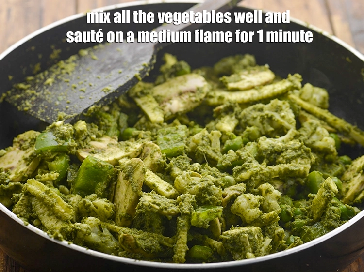 Step 26 – <p>Mix all the vegetables well and <strong>sauté </strong>on a medium flame for 1 minute.</p>