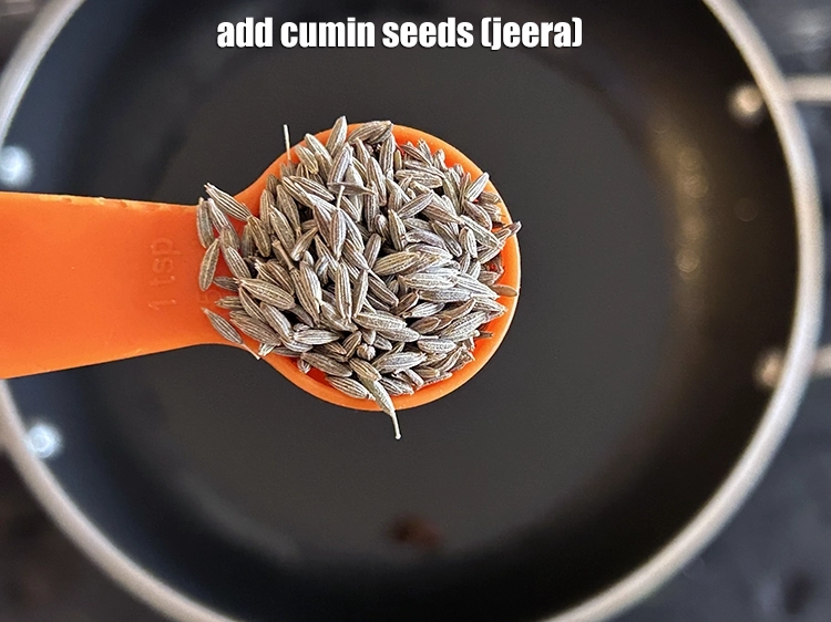 Step 12 – <p><span style="background-color:rgb(255,255,255);color:rgb(0,0,0);">Add the 1 tsp </span><a href="https://www.tarladalal.com/glossary-cumin-seeds-jeera-zeera-381i"><u>cumin seeds (jeera)</u></a>.</p>