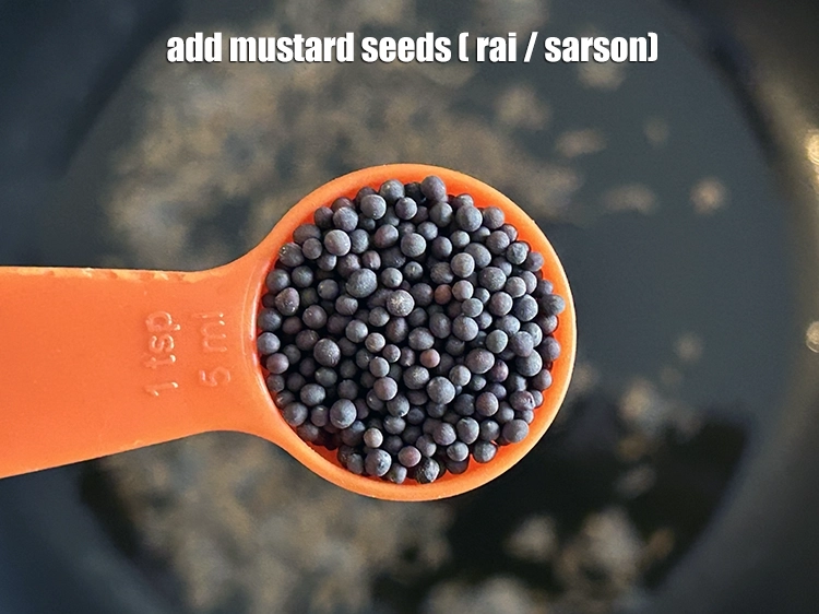 Step 13 – <p>Add the <span style="background-color:rgb(255,255,255);color:rgb(0,0,0);">1 tsp </span><a href="https://www.tarladalal.com/glossary-mustard-seeds-sarson-rai-sarson-ke-beej-525i"><u>mustard seeds ( rai / sarson)</u></a><u>.</u></p>