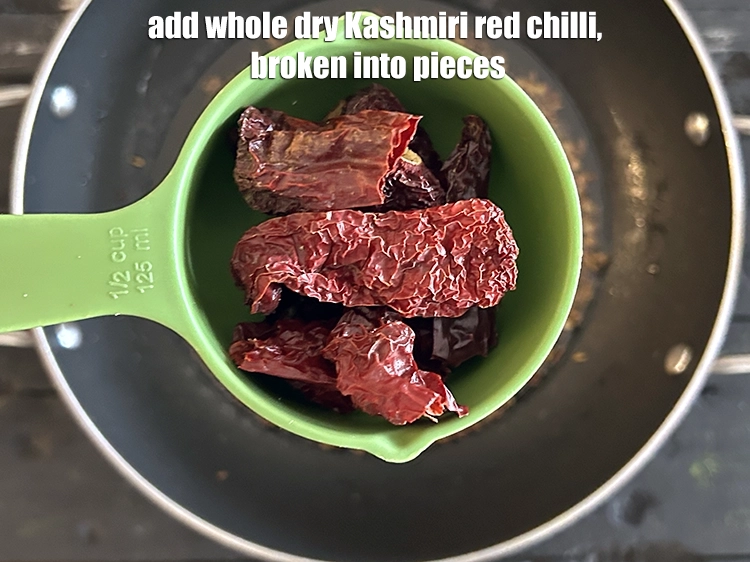 Step 15 – <p>Add the <span style="background-color:rgb(255,255,255);color:rgb(0,0,0);">2 </span><a href="https://www.tarladalal.com/glossary-whole-dry-kashmiri-red-chillies-kashmiri-mirch-kashmiri-lal-mirch-332i"><u>whole dry Kashmiri red chilli </u></a><span style="background-color:rgb(255,255,255);color:rgb(0,0,0);">, broken into pieces.</span></p>