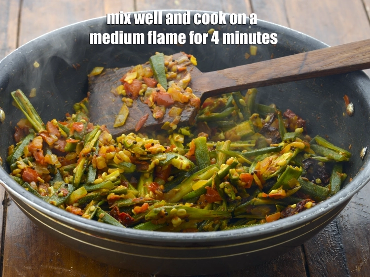 Step 21 – <p><span style="background-color:rgb(255,255,255);color:rgb(0,0,0);">Mix well and cook on a medium flame for 4 minutes, while stirring occasionally.</span></p>