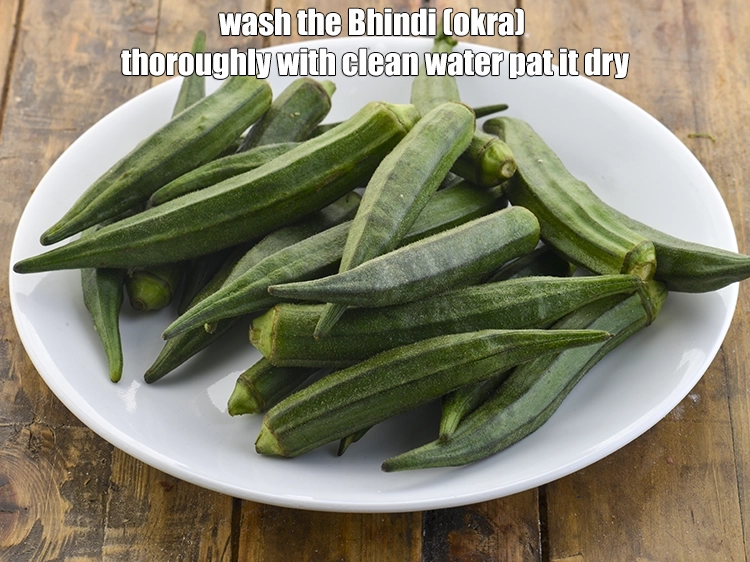 Step 4 – <p><strong>Wash </strong>the<strong> </strong><a href="https://www.tarladalal.com/glossary-ladies-finger-bhindi-okra-bhinda-lady-finger-491i#ing_2352"><u>ladies finger (bhindi)</u></a> thoroughly with clean water <strong>pat it dry</strong>.</p>