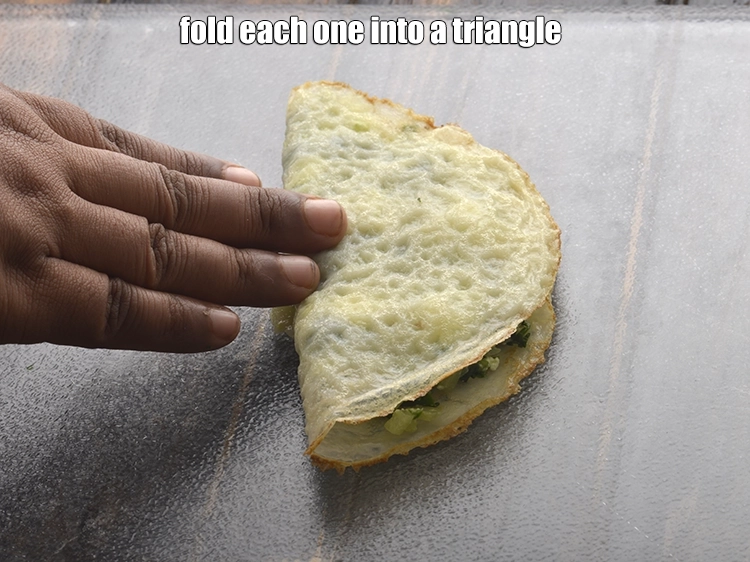 Step 8 – <p><span style="background-color:rgb(255,255,255);color:rgb(0,0,0);"><strong>Fold</strong> each one into a triangle.</span></p>