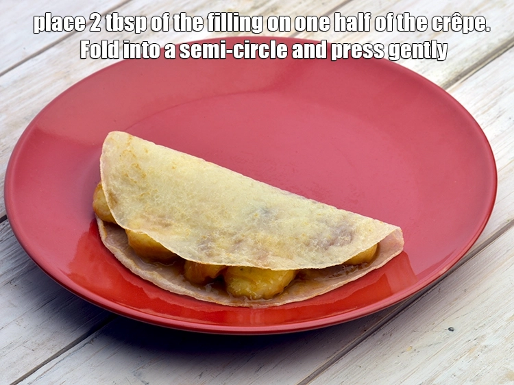 Step 5 – <p><span style="background-color:rgb(255,255,255);color:rgb(0,0,0);">Place 2 tbsp. of the <strong>filling</strong> on one half of the <strong>crêpe</strong>. Fold into …