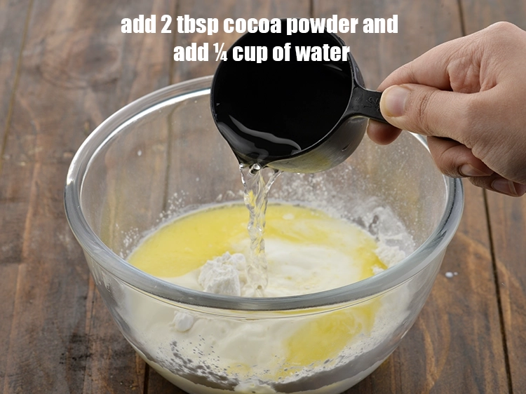 Step 6 – <p><span style="background-color:rgb(255,255,255);color:rgb(0,0,0);">add 2 tbsp </span><a href="https://www.tarladalal.com/glossary-cocoa-powder-284i"><u>cocoa powder</u></a><u>, and </u><span style="background-color:rgb(255,255,255);color:rgb(0,0,0);">add approximately ¼ cup of <strong>water …