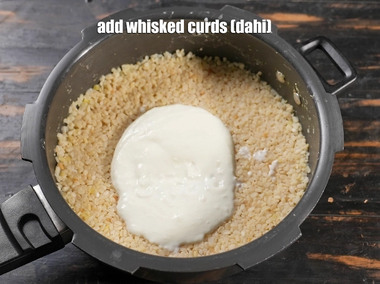 Step 13 – <p><span style="background-color:rgb(255,255,255);color:rgb(0,0,0);">Add ½ cup </span><a href="https://www.tarladalal.com/glossary-whisked-curds--2096i"><u>whisked curds (dahi)</u></a><span style="background-color:rgb(255,255,255);color:rgb(0,0,0);">.</span></p>