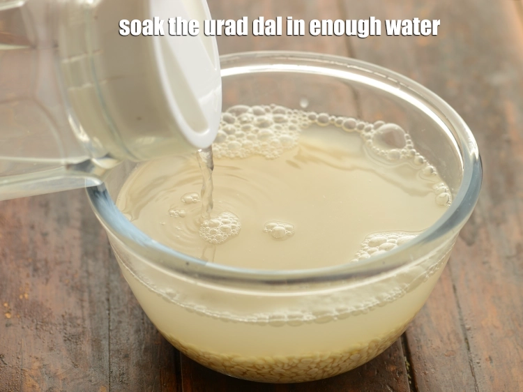 Step 5 – <p>Soak the <strong>urad dal</strong> in enough <strong>water</strong>.</p>