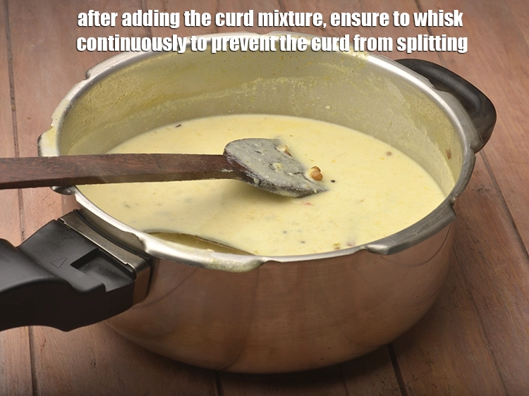 Step 27 – <p>After adding the <strong>curd mixture</strong>, ensure to whisk continuously to prevent the curd from splitting.</p>