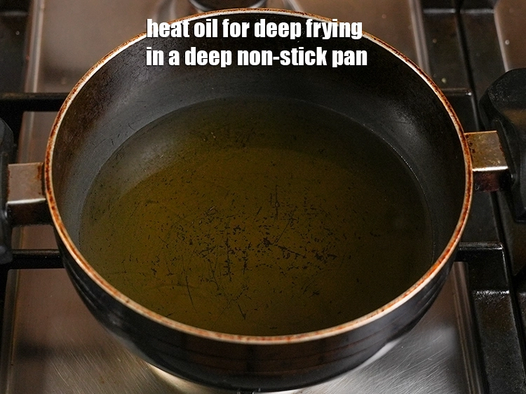 Step 5 – <p><span style="background-color:rgb(255,255,255);color:rgb(0,0,0);">Heat the </span><a href="https://www.tarladalal.com/glossary-oil-671i"><u>oil</u></a><span style="background-color:rgb(255,255,255);color:rgb(0,0,0);"> for deep frying in a deep non-stick pan.</span></p>