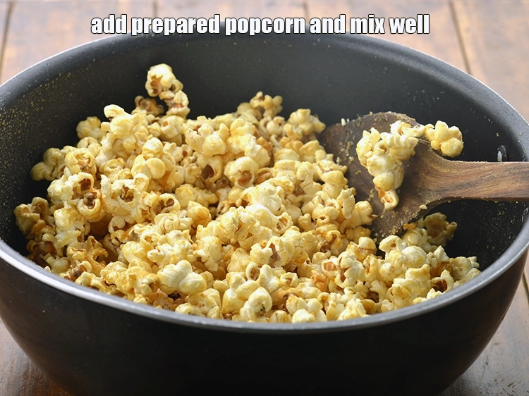 Step 10 – <p><span style="background-color:rgb(255,255,255);color:rgb(0,0,0);">Switch off the flame, add the <strong>prepared popcorn</strong> and mix well.</span></p>