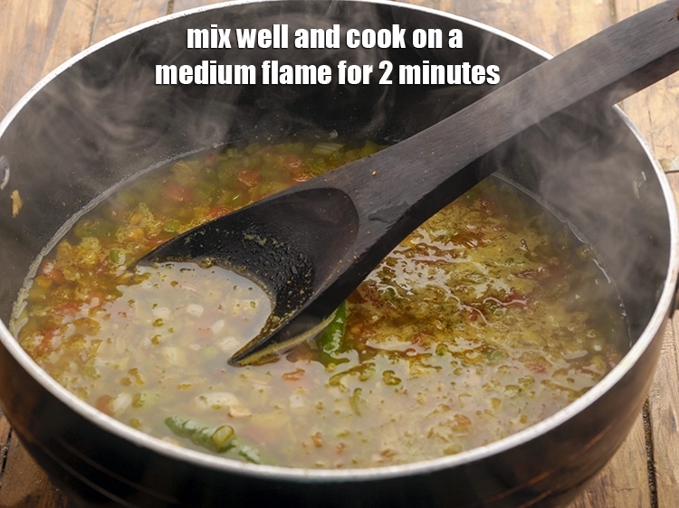 Step 20 – <p>Mix well and cook on a medium flame for 2 minutes, while stirring occasionally.</p>