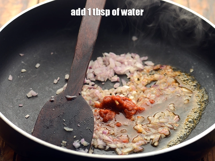 Step 13 – <p>Add 1 tbsp of <strong>water</strong>. Dry roast on a medium flame for about 1 minute.</p>