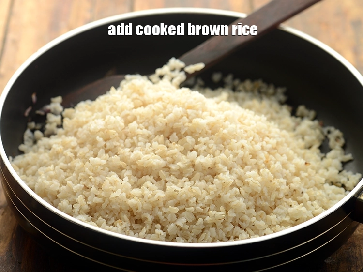 Step 28 – <p>Add the <a href="https://www.tarladalal.com/glossary-brown-rice-1618i#ing_2895"><u>cooked brown rice</u></a>.</p>