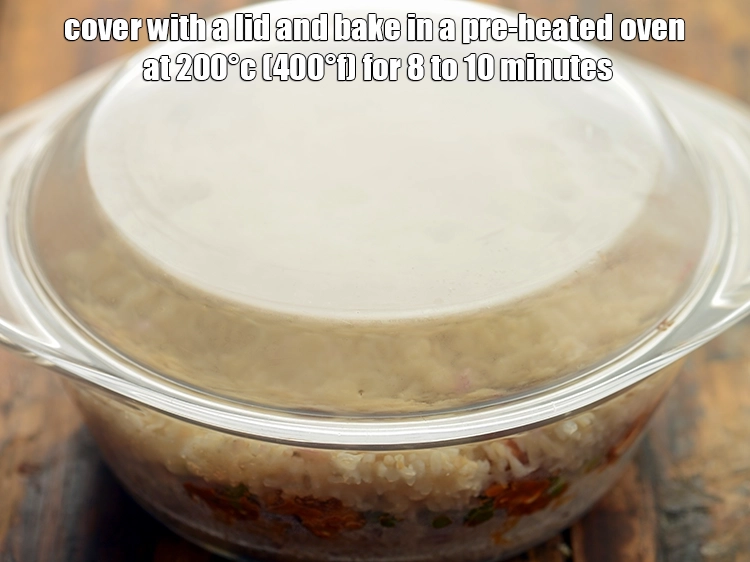 Step 34 – <p><strong>Cover with a lid</strong> and bake <strong>paneer mutter biryani</strong> in a preheated oven at 200°C …