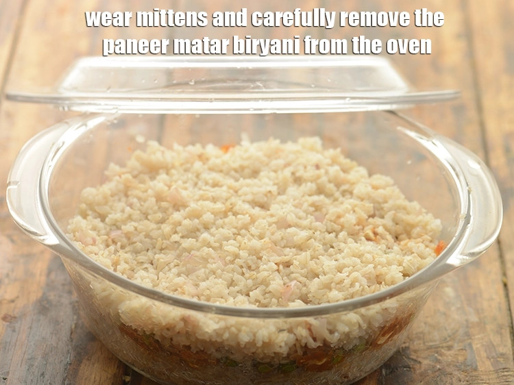 Step 35 – <p><strong>Wear mittens</strong> and carefully remove the <strong>paneer matar biryani</strong> from the oven.</p>