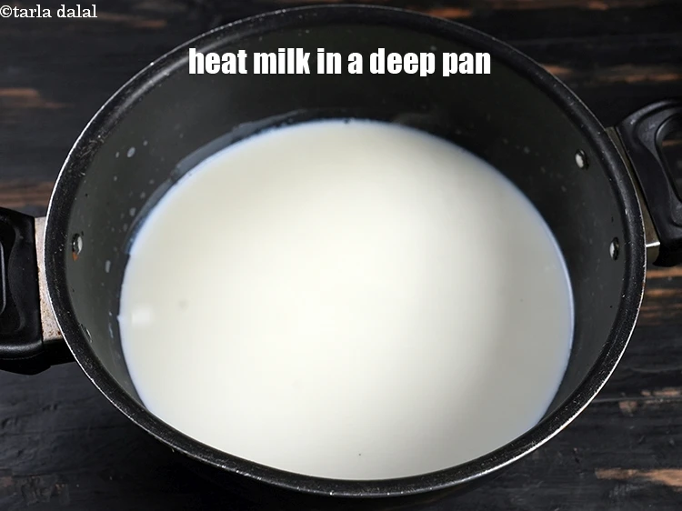 Step 5 – <p>Heat the remaining cold <a href="https://www.tarladalal.com/glossary-milk-doodh-full-cream-milk-514i"><u>milk</u></a> &nbsp;in a deep non-stick pan.</p>