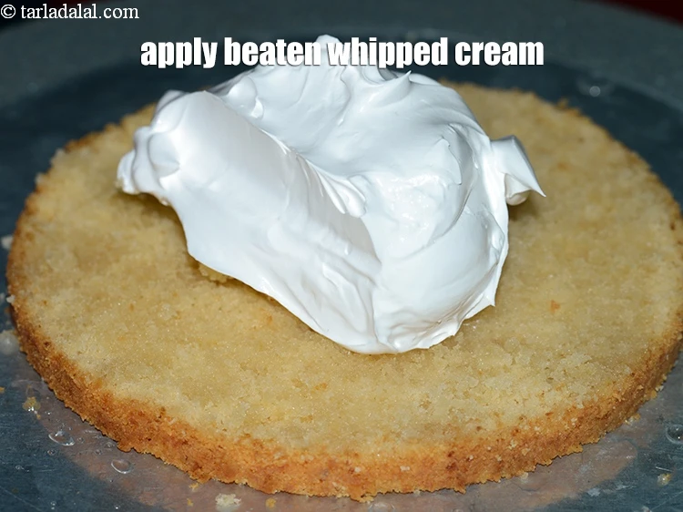 Step 8 – <p><span style="background-color:rgb(255,255,255);color:rgb(0,0,0);">Apply ½ cup </span><a href="https://www.tarladalal.com/glossary-beaten-whipped-cream-1948i"><u>beaten whipped cream</u></a><span style="background-color:rgb(255,255,255);color:rgb(0,0,0);">.</span></p>