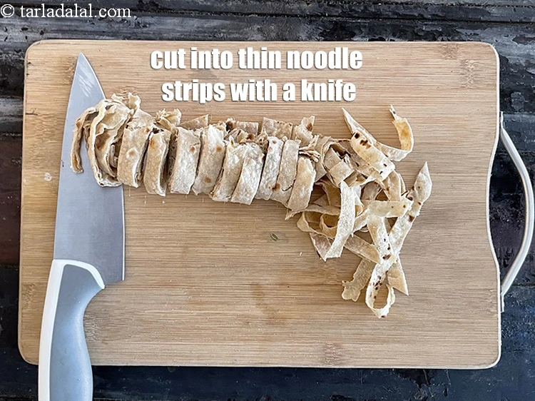 Step 6 – <p>Cut into thin noodle strips with a knife.</p>