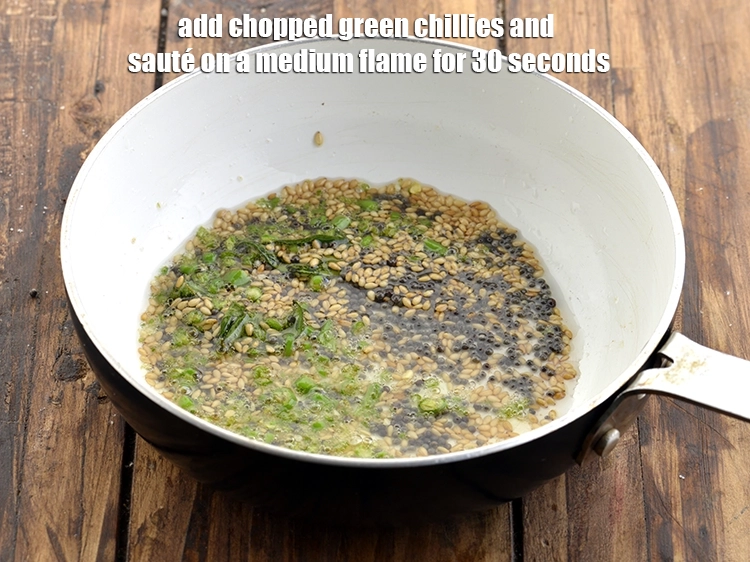 Step 21 – <p>Now add the <span style="background-color:rgb(255,255,255);color:rgb(0,0,0);">1 tsp </span><a href="https://www.tarladalal.com/glossary-green-chillies-hari-mirch-331i#ing_2388"><u>chopped green chillies</u></a>. <span style="background-color:rgb(255,255,255);color:rgb(0,0,0);"><strong>Sauté</strong></span><strong> </strong>on a medium …