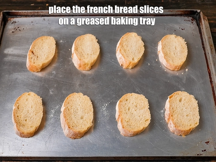 Step 3 – <p><span style="background-color:rgb(255,255,255);color:rgb(0,0,0);">Place the <strong>french bread slices</strong> on a greased baking tray.</span></p>