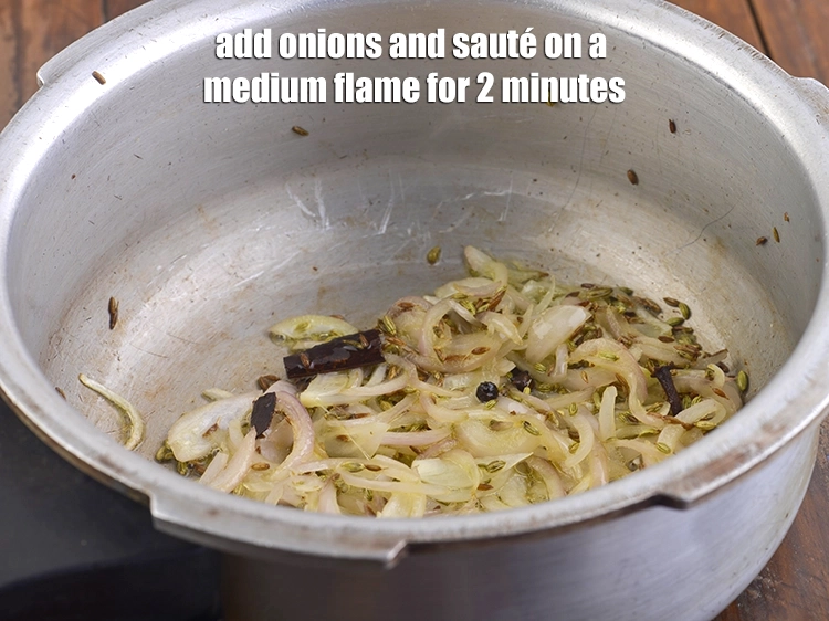 Step 11 – <p><span style="background-color:rgb(255,255,255);color:rgb(0,0,0);">Add the 1/2 cup </span><a href="https://www.tarladalal.com/glossary-onions-pyaz-pyaaz-kanda-548i#ing_2342"><u>sliced onions</u></a><span style="background-color:rgb(255,255,255);color:rgb(0,0,0);"> and <strong>sauté</strong> on a medium flame …