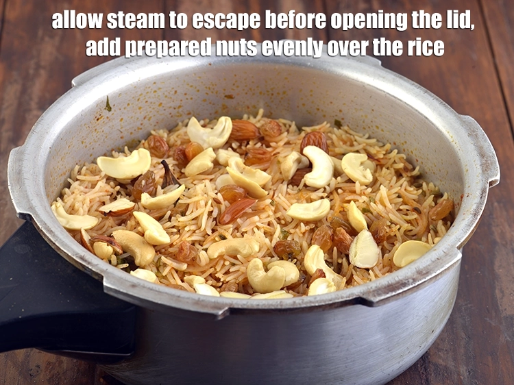 Step 16 – <p><span style="background-color:rgb(255,255,255);color:rgb(0,0,0);">Allow the steam to escape before opening the lid. Add the <strong>prepared nuts</strong> evenly …