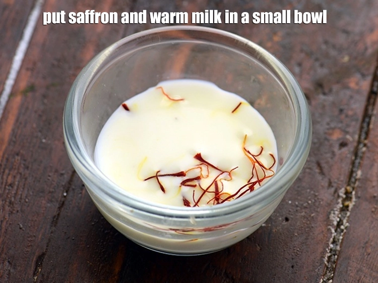 Step 6 – <p>Put <span style="background-color:rgb(255,255,255);color:rgb(0,0,0);">the </span><a href="https://www.tarladalal.com/glossary-saffron-kesar-520i"><u>saffron (kesar) strands</u></a><span style="background-color:rgb(255,255,255);color:rgb(0,0,0);"> and 2 tsp warm </span><a href="https://www.tarladalal.com/glossary-milk-doodh-full-cream-milk-514i"><u>milk</u></a><span style="background-color:rgb(255,255,255);color:rgb(0,0,0);"> …