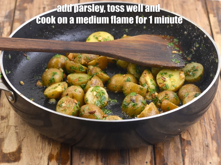 Step 5 – <p><span style="background-color:rgb(255,255,255);color:rgb(0,0,0);">Add the 1/4 cup finely </span><a href="https://www.tarladalal.com/glossary-parsley-393i#ing_2371"><u>chopped parsley</u></a><span style="background-color:rgb(255,255,255);color:rgb(0,0,0);">, <strong>toss well </strong>and cook on …