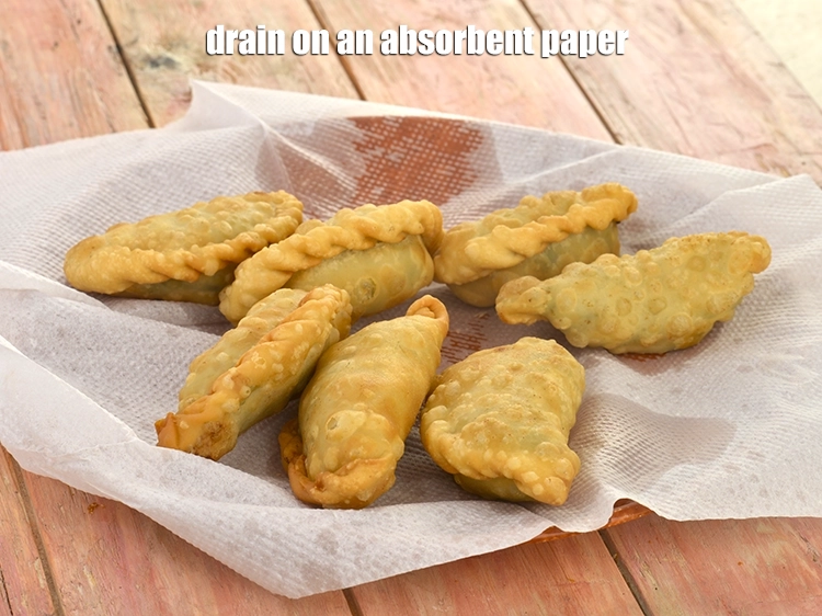 Step 11 – <p><span style="background-color:rgb(255,255,255);color:rgb(0,0,0);">Deep-fry, a few <strong>sambousek</strong> at a time on a slow flame till they turn …