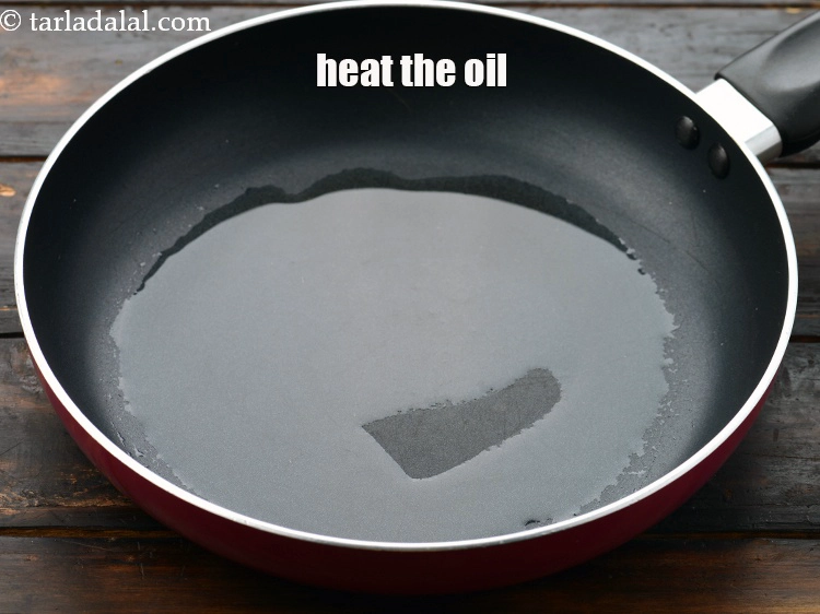 Step 2 – <p><span style="background-color:rgb(255,255,255);color:rgb(0,0,0);">To make the </span><strong>spinach and cheese mixture, </strong><span style="background-color:rgb(255,255,255);color:rgb(0,0,0);">Heat the 2 tsp </span><a href="https://www.tarladalal.com/glossary-oil-671i"><u>oil</u></a><span …