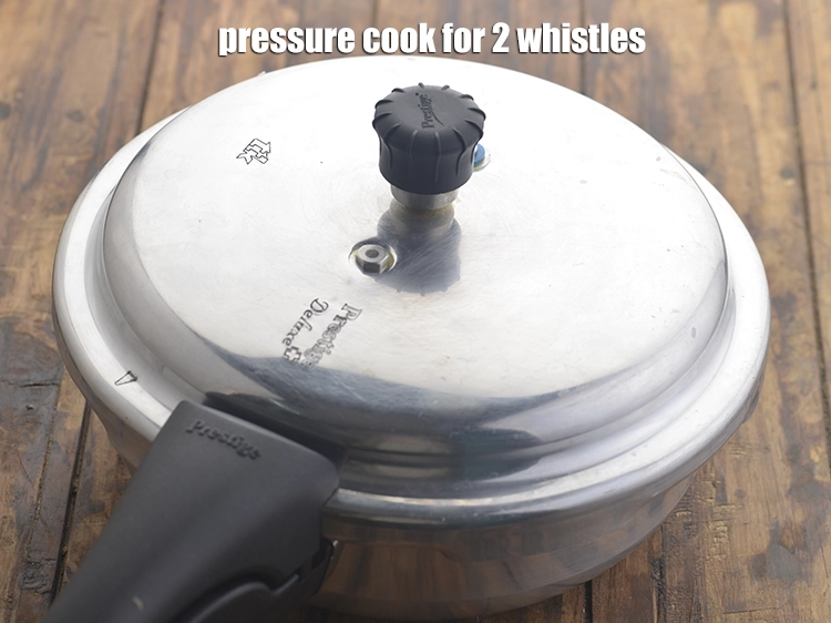 Step 8 – <p><span style="background-color:rgb(255,255,255);color:rgb(0,0,0);">Pressure cook for 2 whistles.</span></p>
