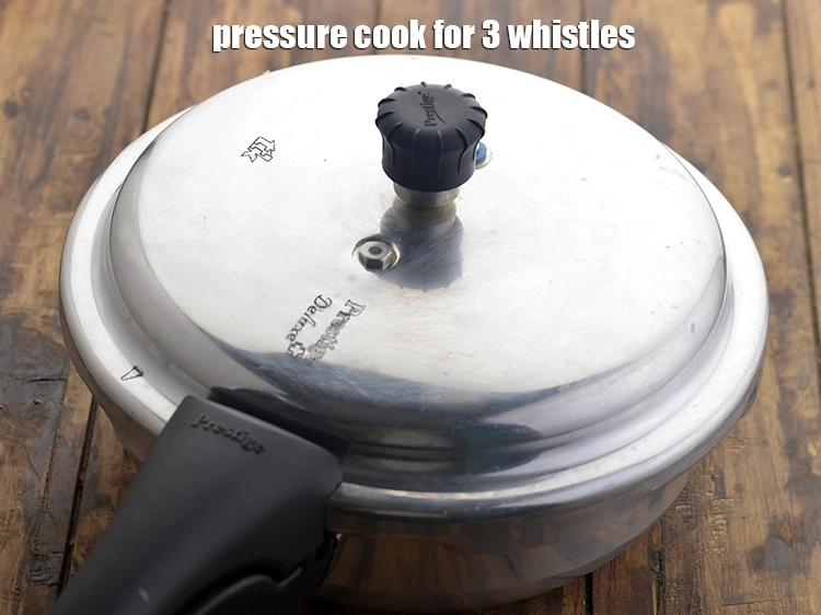 Step 5 – <p><span style="background-color:rgb(255,255,255);color:rgb(0,0,0);">Pressure cook for 3 whistles.</span></p>