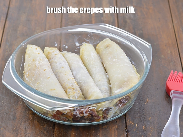 Step 14 – <p><span style="background-color:rgb(255,255,255);color:rgb(0,0,0);">Brush the <strong>crepes</strong> with 1/2 tbsp. </span><a href="https://www.tarladalal.com/glossary-milk-doodh-full-cream-milk-514i"><u>milk</u></a><span style="background-color:rgb(255,255,255);color:rgb(0,0,0);">.</span></p>