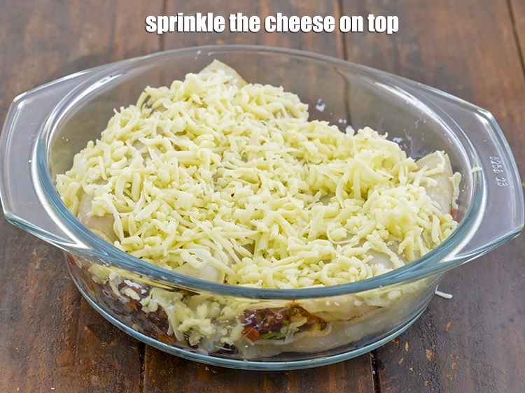 Step 15 – <p><span style="background-color:rgb(255,255,255);color:rgb(0,0,0);">Sprinkle the 1/2 cup </span><a href="https://www.tarladalal.com/glossary-processed-cheese-315i#ing_3090"><u>grated processed cheese</u></a><span style="background-color:rgb(255,255,255);color:rgb(0,0,0);"> on top.</span></p>