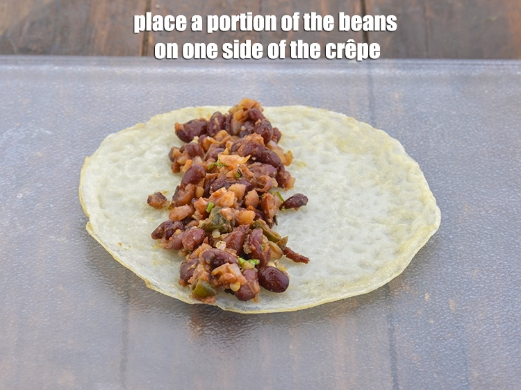 Step 9 – <p><span style="background-color:rgb(255,255,255);color:rgb(0,0,0);">Place a </span><a href="https://www.tarladalal.com/eggless-crepe-36866r"><u>crepes</u></a><span style="background-color:rgb(255,255,255);color:rgb(0,0,0);"> on a clean, dry surface and place a portion …