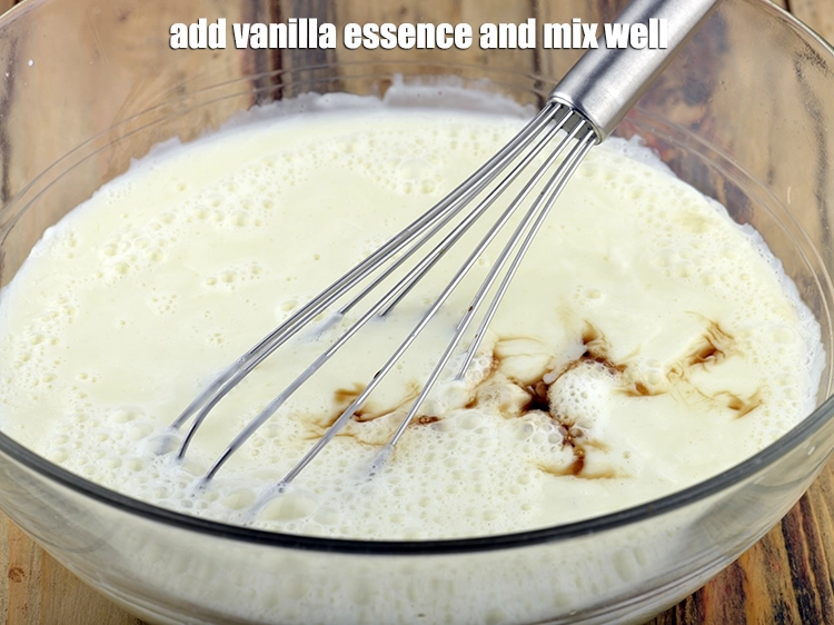 Step 5 – <p><span style="background-color:rgb(255,255,255);color:rgb(0,0,0);">Add the 1 tsp </span><a href="https://www.tarladalal.com/glossary-vanilla-essence-406i"><u>vanilla essence</u></a><span style="background-color:rgb(255,255,255);color:rgb(0,0,0);"> and mix well.</span></p>