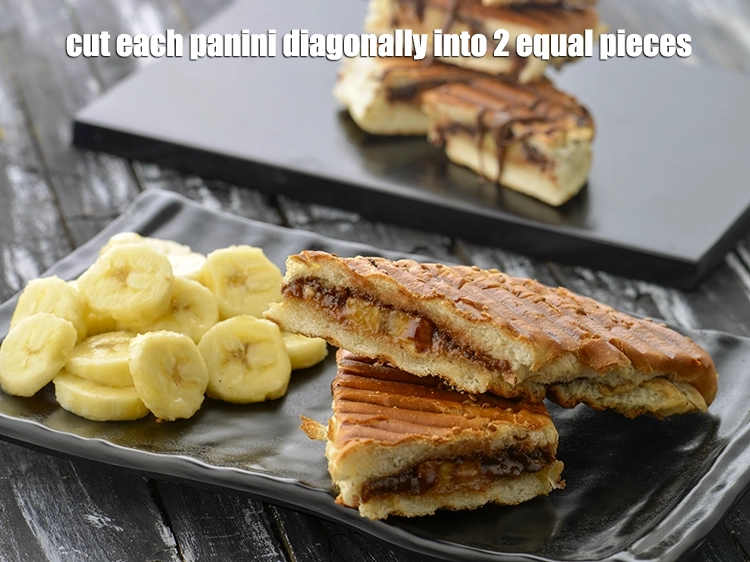 Step 11 – <p><span style="background-color:rgb(255,255,255);color:rgb(0,0,0);">Cut each <strong>panini</strong> diagonally into 2 equal pieces.</span></p>